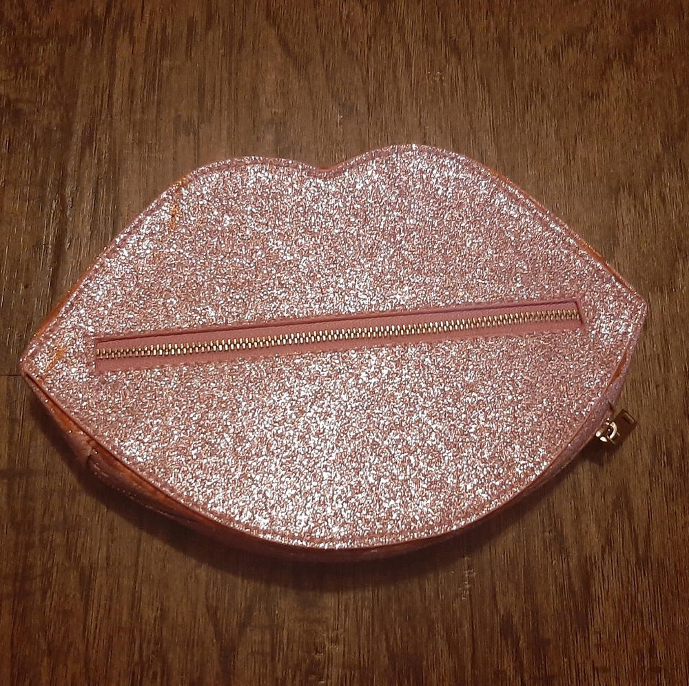 Shimmery Pink Clutch shaped like lips.